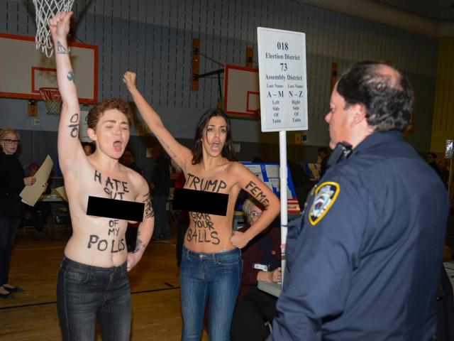 Thế giới - Phụ nữ ngực trần gây náo loạn nơi Donald Trump bỏ phiếu