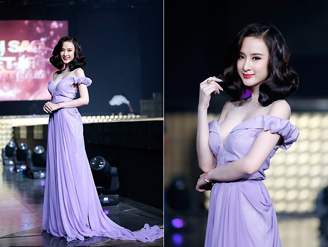 Chiếc váy tím nhã nhặn cùng cách làm tóc cổ điển này giúp Angela Phương Trinh "ghi điểm" khi xuất hiện tại chương trình Ngôi sao thiết kế thời trang 2014.