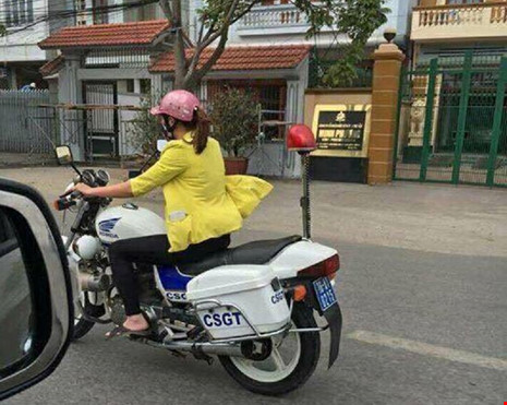 Cô gái mặc áo vàng đi xe đặc chủng CSGT là nhân viên sửa xe - 1