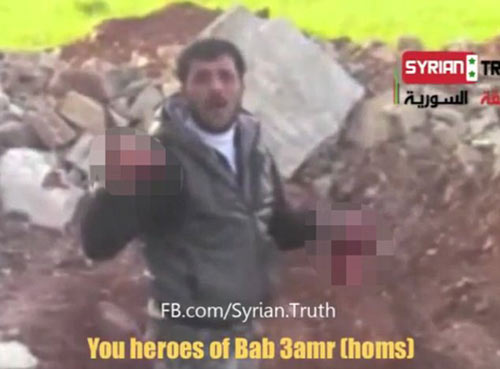 Syria: Ghê rợn video ăn tim xác lính - 2