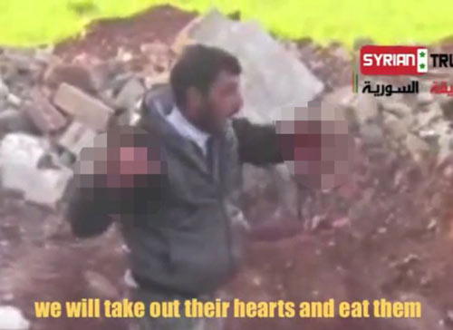 Syria: Ghê rợn video ăn tim xác lính - 3