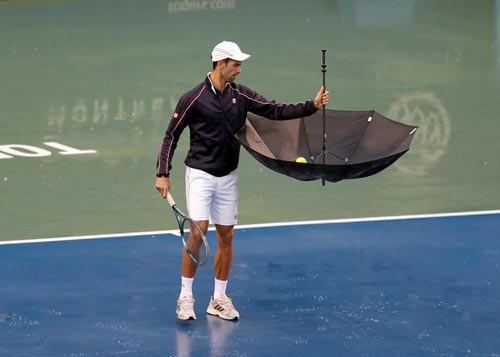 Djokovic đội mưa “luyện công” - 2