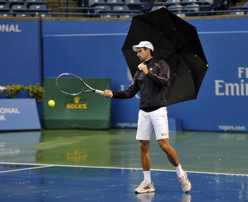 Djokovic đội mưa “luyện công” - 1