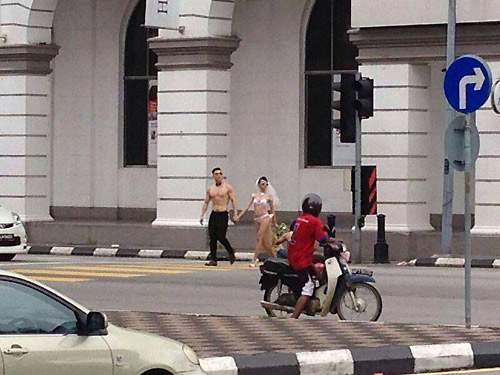 Ra hầu tòa vì chụp ảnh cưới bán nude giữa phố - 1