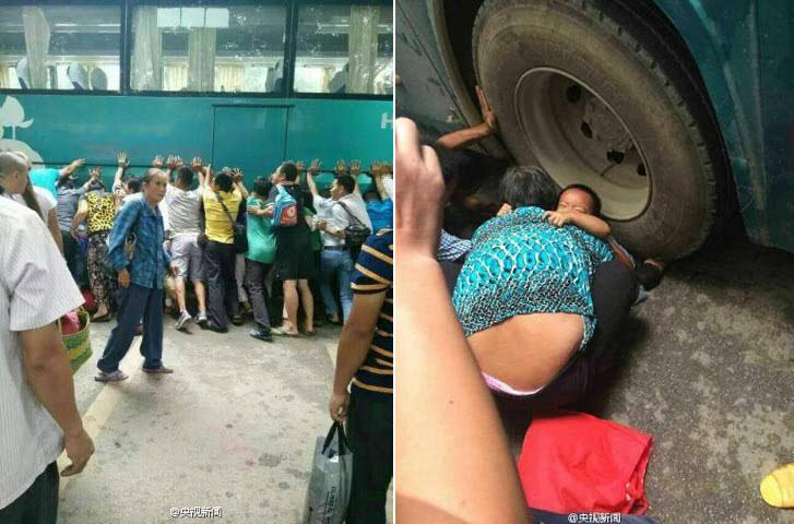 TQ: 100 người nâng xe buýt cứu bé gái mắc kẹt - 1