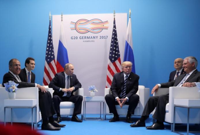 Trump và Putin lần đầu gặp mặt: Lâu gấp 4 lần dự kiến - 1