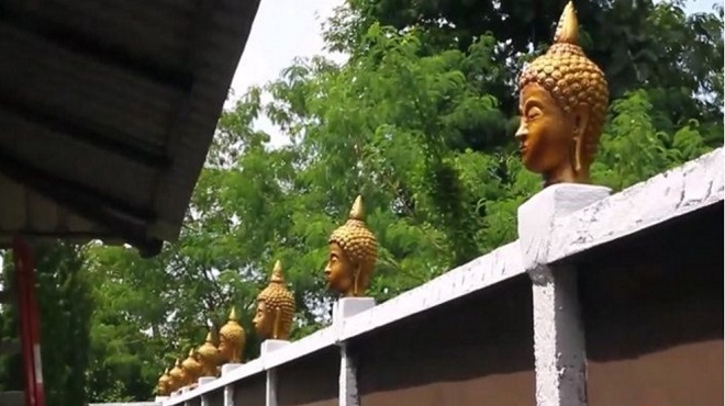 Thái Lan: Đặt 33 đầu tượng Phật trên tường rào để trang trí - 1