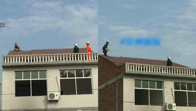 Cãi nhau với chồng, vợ leo lên mái nhà dỡ ngói ném xuống - 1